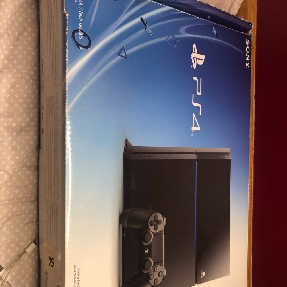 Sony PlayStation 4 with cords no controller.